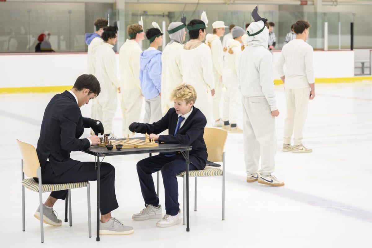 Markus Gentile ’28 plays chess with Jack Fischer ’28 during DeWindt’s ice skit