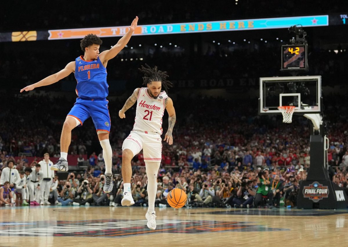 Houston guard Emanuel Sharp dropping the ball in final possession of the game after his failed three-pointer, blocked by Walter Clayton Jr. Sharp was unable to touch the ball again or he would have been called for a violation