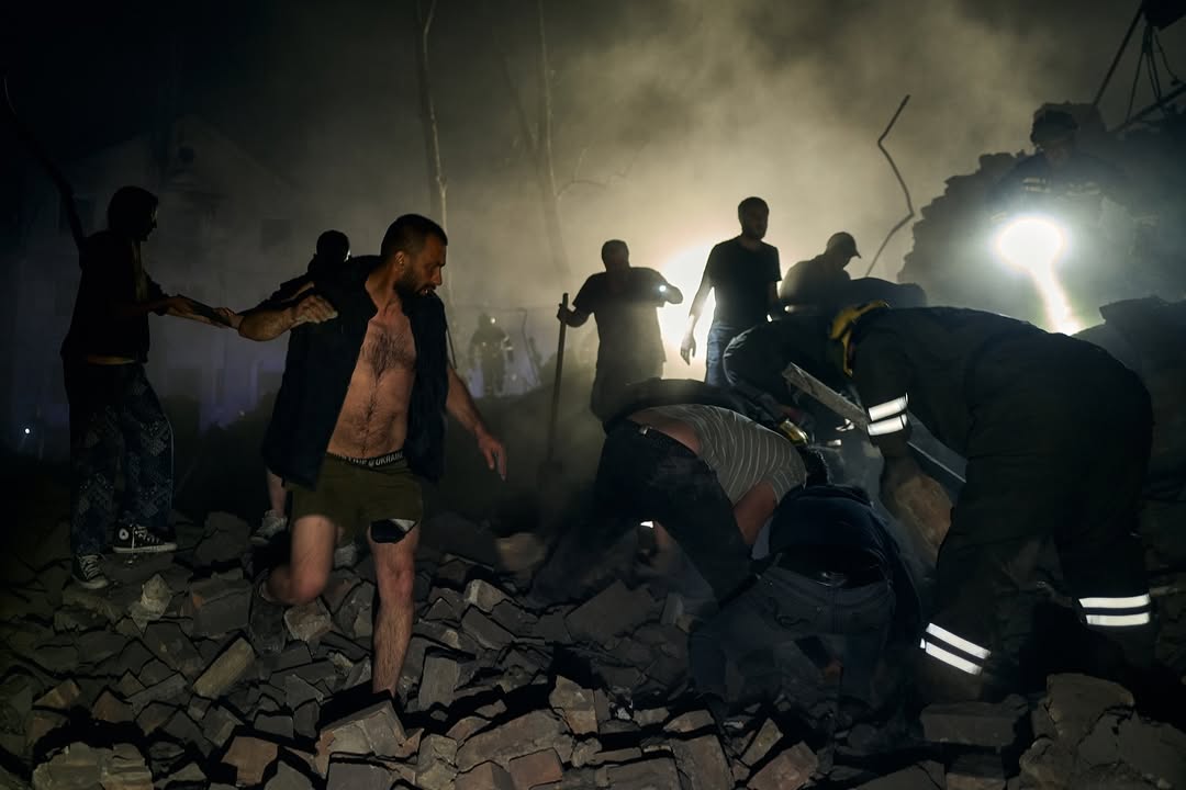 Rescuers searching for survivors after a Russian attack