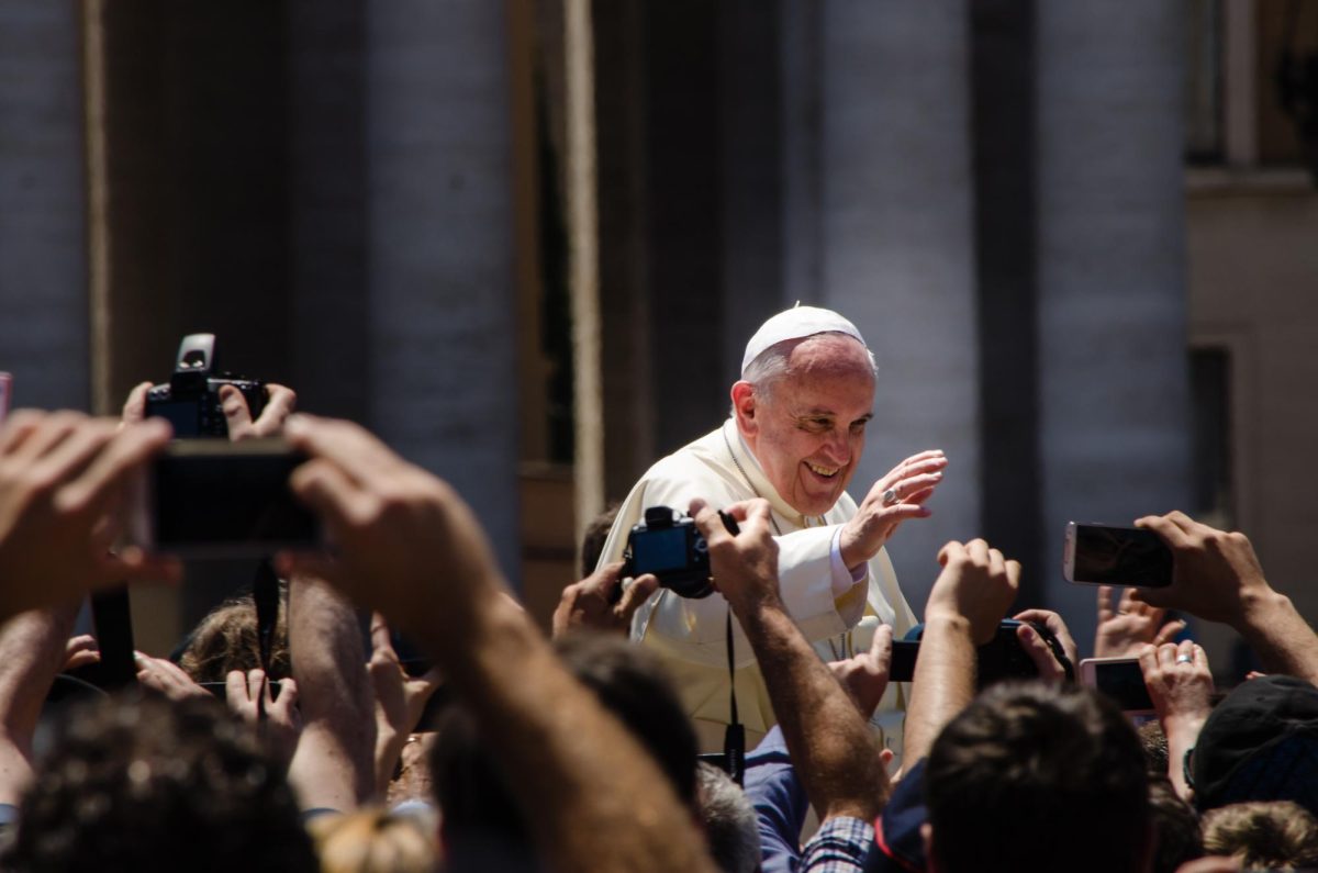 Pope Francis waving to supporters